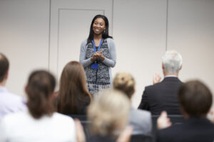 Woman being confident when presenting in front of a group