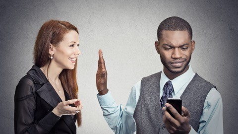 Man holding up his hand to stop a one-on-one conversation